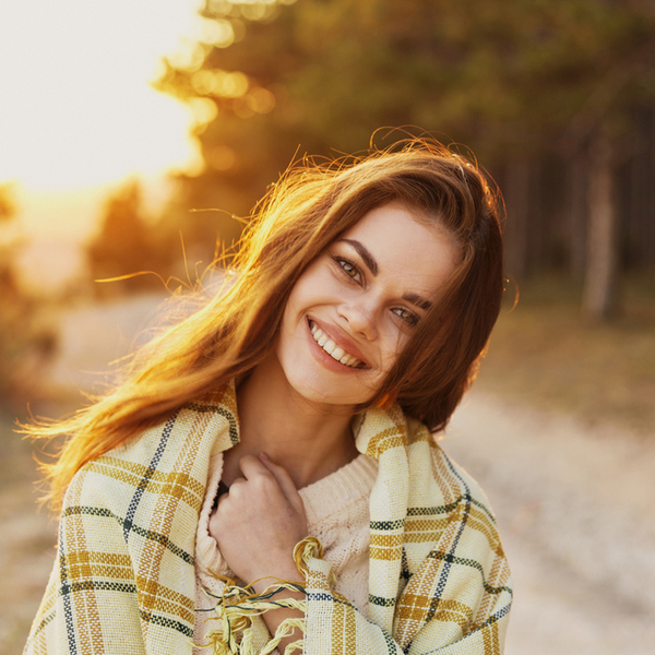 Young Woman with Blanket Outdoors